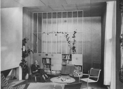 Boyd Camberwell house. A space divider screens the living room from the front door, which is up several steps and set in a lime-green wall. The ceiling is caneite, the floor cork-tiled. Patricia sits in one of Featherston’s Relaxation chairs of 1947, and a locally made version of one of Marcel Breuer’s cantilever chairs adds to the contemporary ambience.